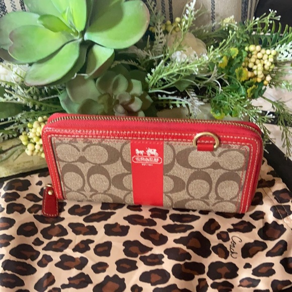 Coach Handbags - Women’s Coach Heritage Stripe long zip wallet.